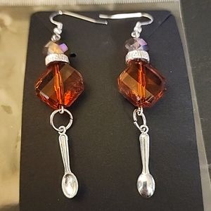 Orange beaded earrings with spoon charms
